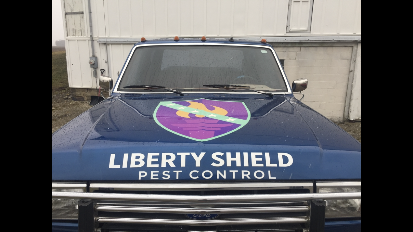 Blue pest control truck with 