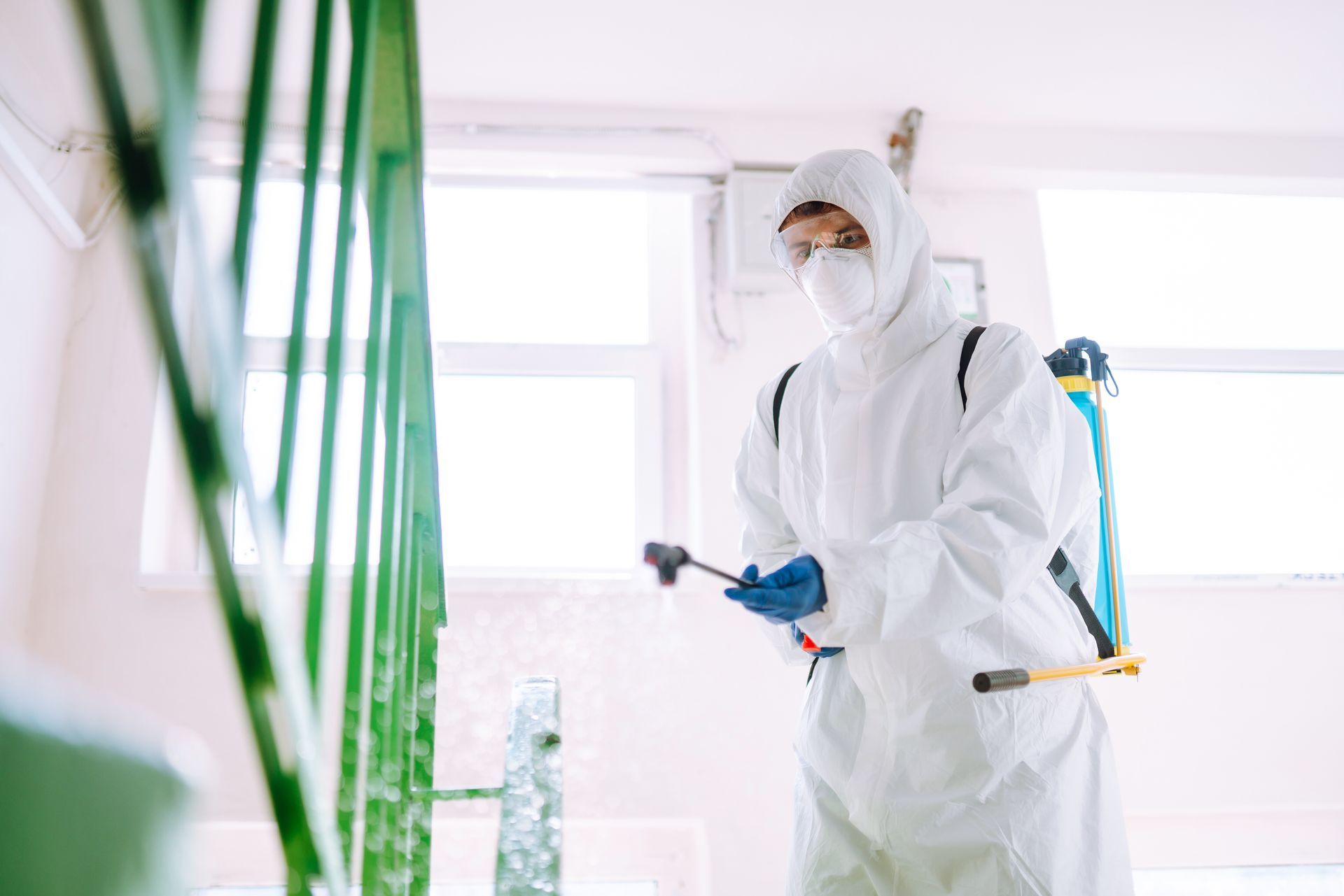 pest control worker spraying pesticides in Sandusky, OH