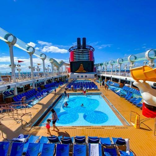 a large swimming pool on the deck of a cruise ship