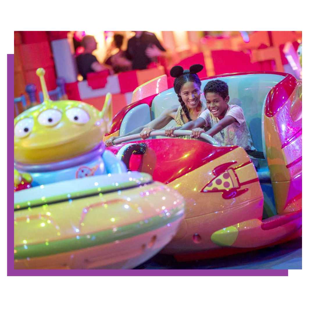 a group of people are riding a roller coaster at an amusement park .