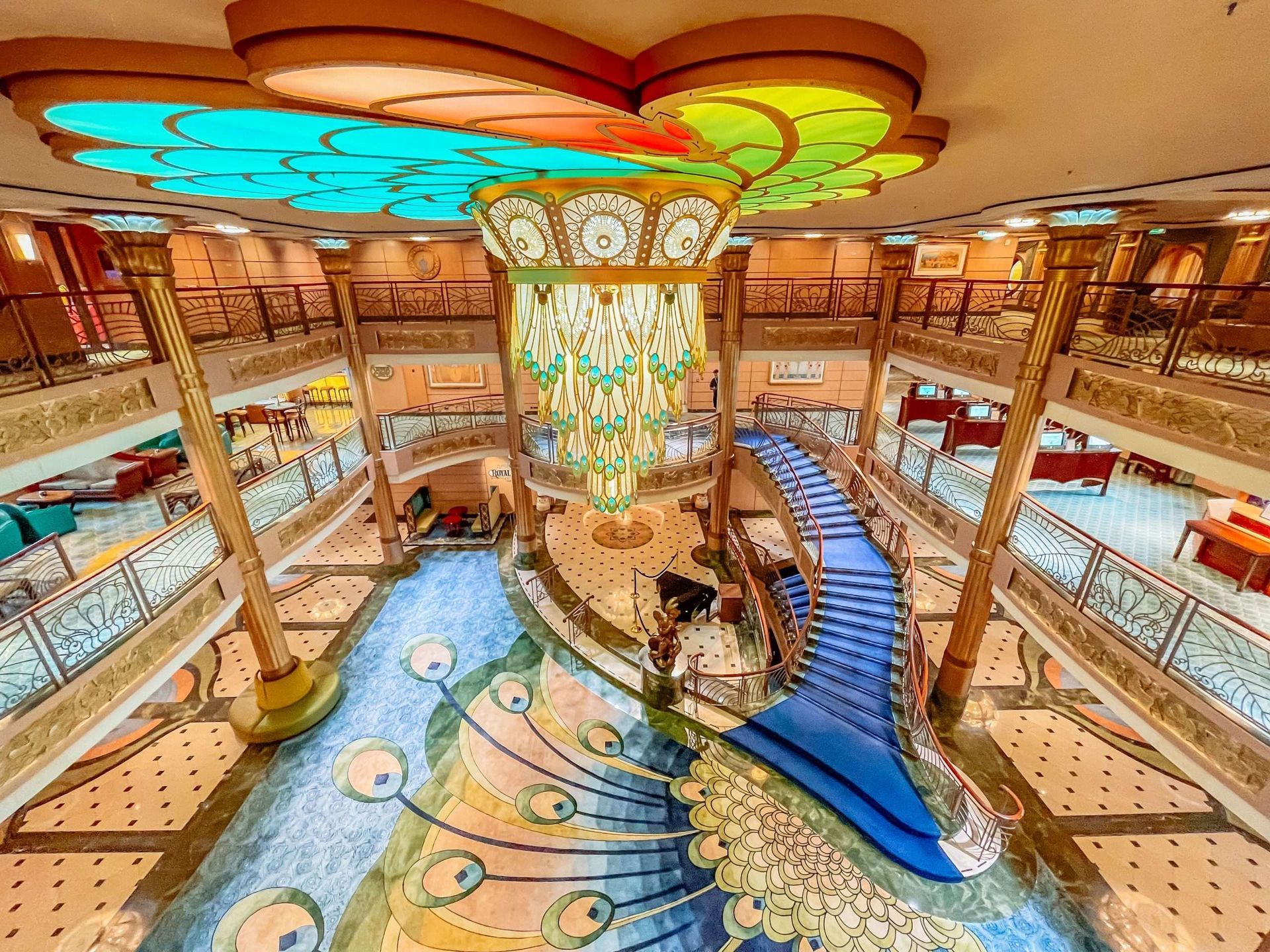 a group of people are riding a roller coaster with slinky dog .