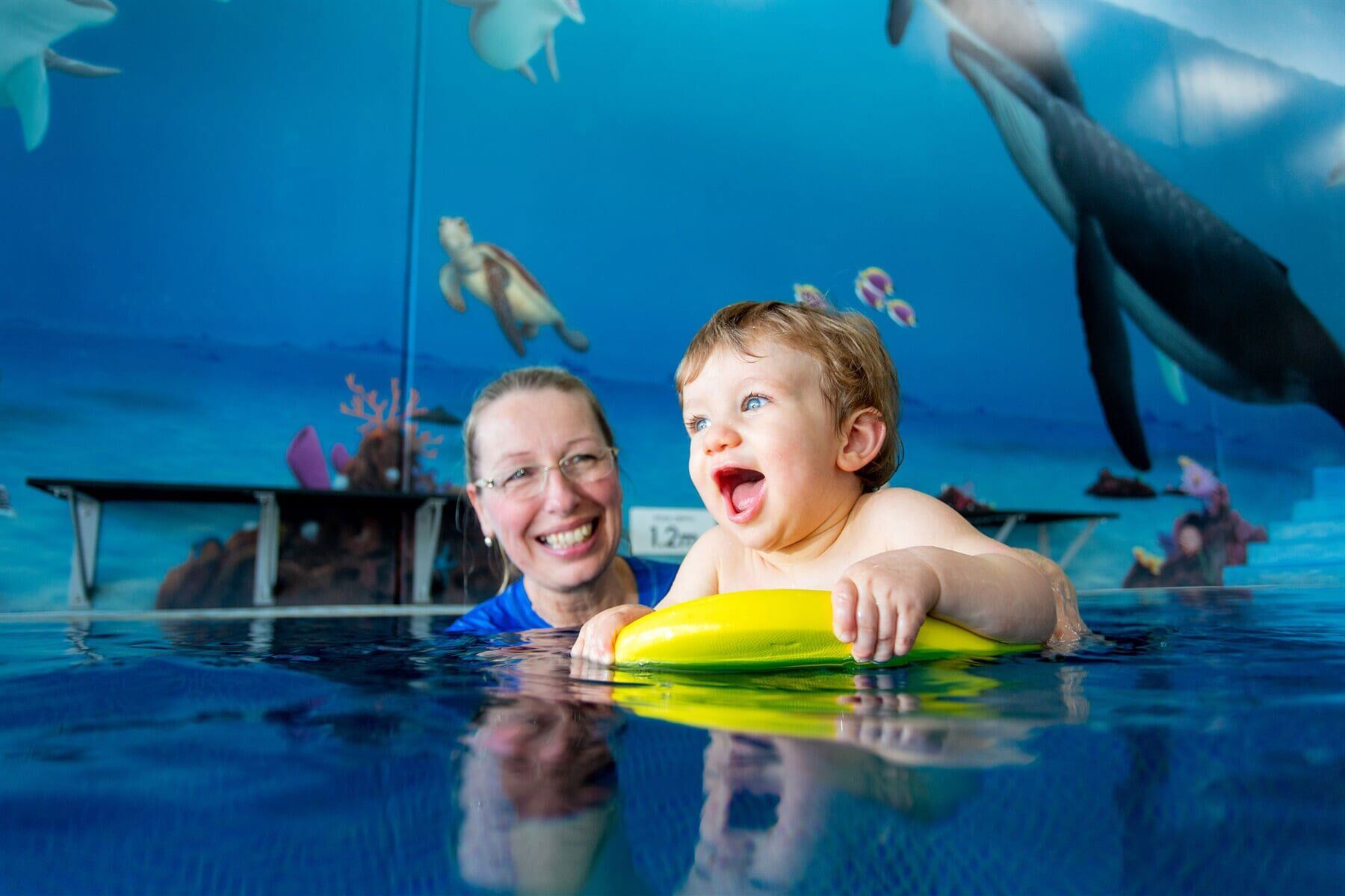 Teaching a 6 Months Baby How to Swim on the Pool