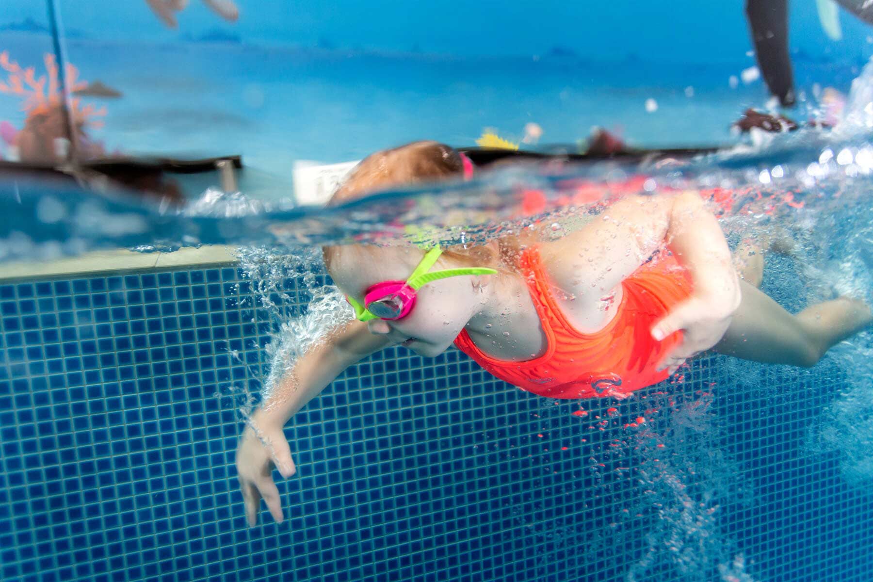 Girl Swimming Wearing Orange Swimsuit - Kids Swimming Lessons Coffs Harbour