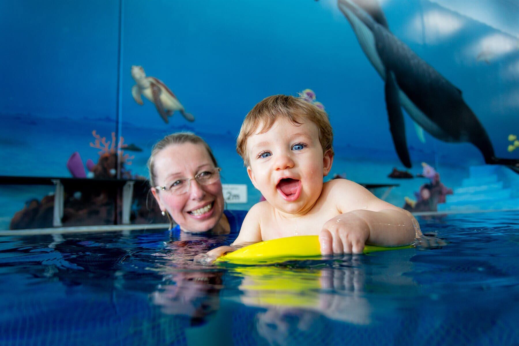 Staff Teaching Baby to Swim — Swim School in Coffs Harbour, NSW