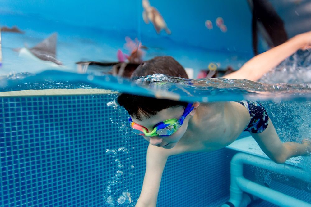 Kid Swimming Wearing Goggles