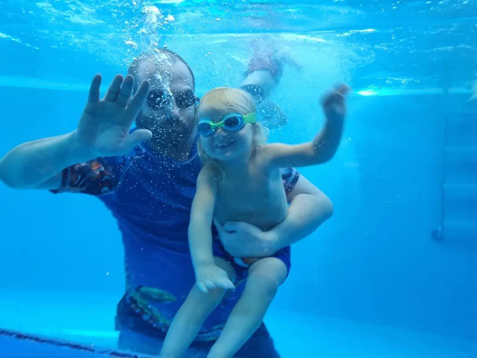 Trainer And Kid in Pool