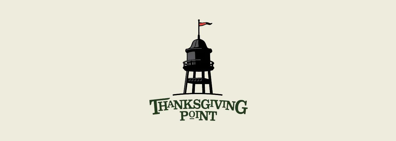 Thanksgiving Point logo with black water tower and red flag. Dark green text below.