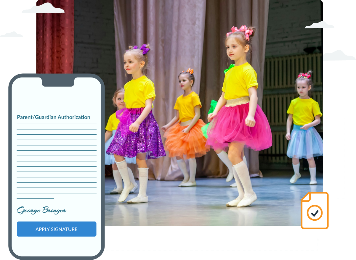A group of young girls are dancing on a stage next to a cell phone.