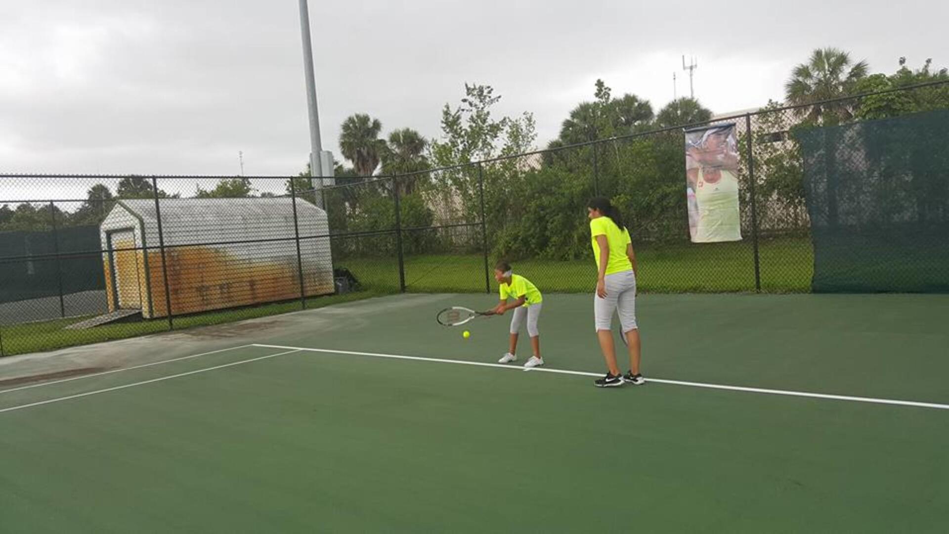 Two Female Students Playing Tennis — Miami, FL — Meagan’s Academic Tutorial Center