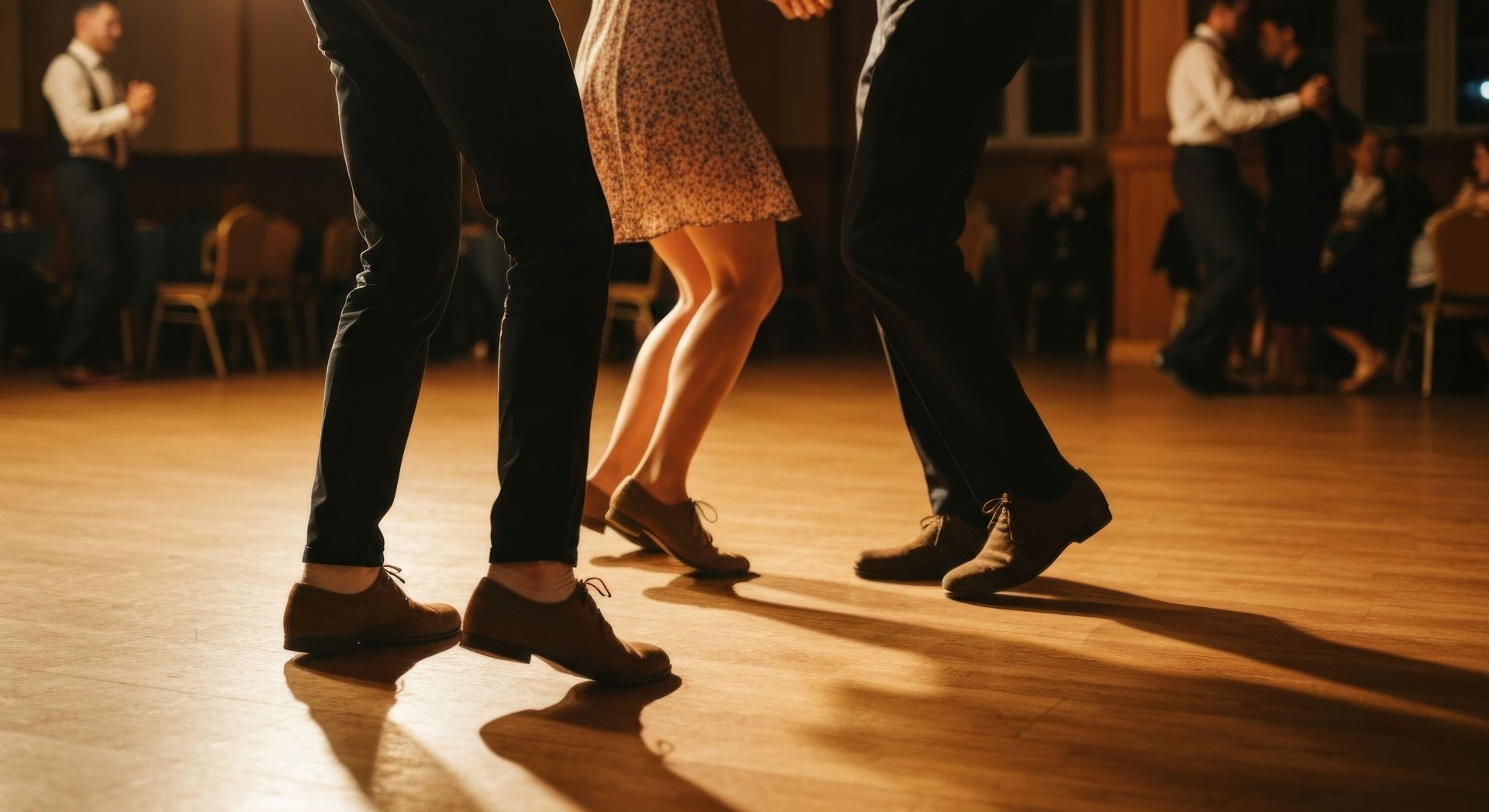 Close-up of elegant footwork during professional ballroom dance classes at a lively social.