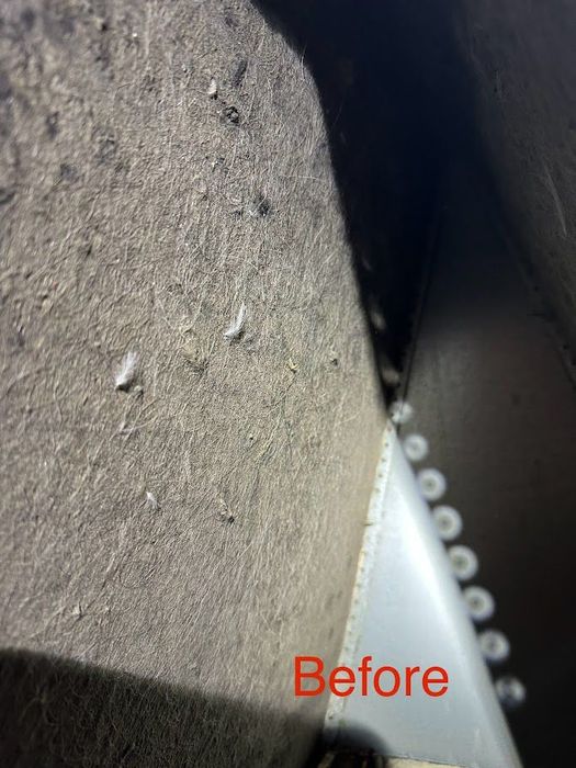 Damaged electrical panel in a narrow wall cavity, labeled “Before,” with exposed wires and rust.
