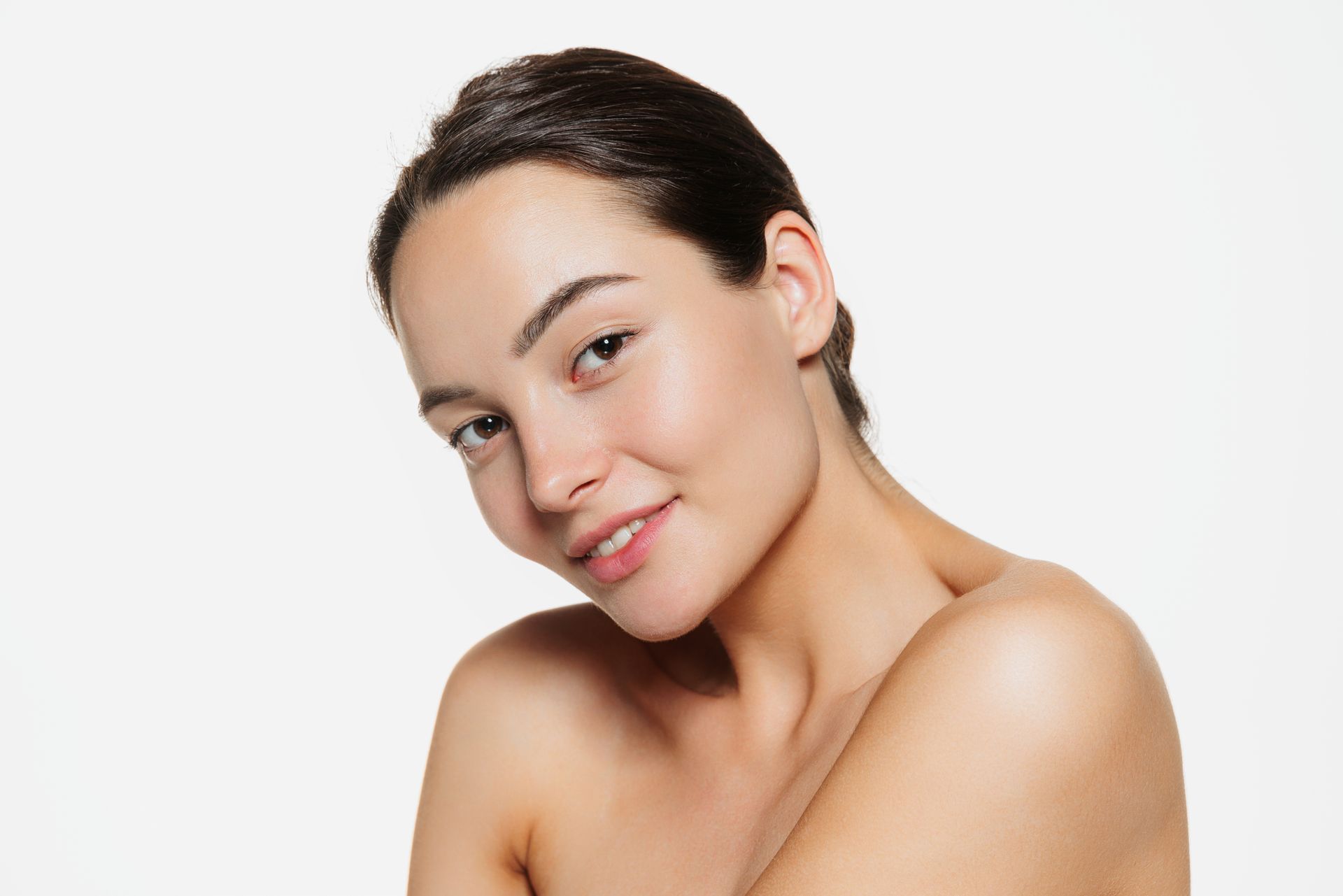 A close up of a woman 's face with a white background.