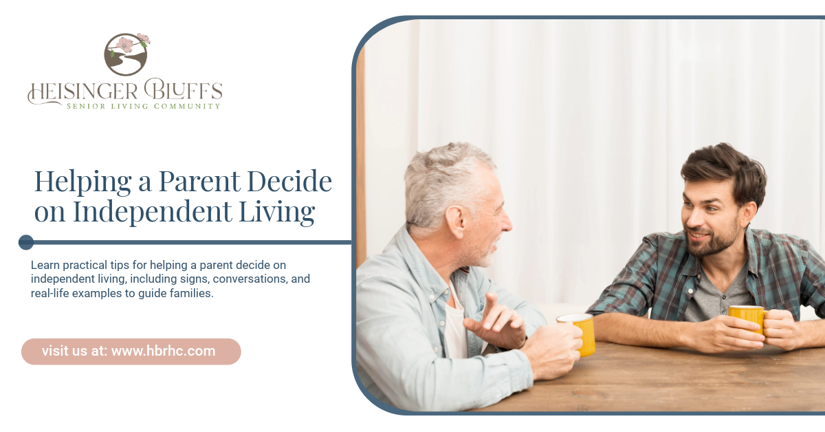 An adult and his senior dad sitting on a table, drinking a cup of coffee, talking about independent 