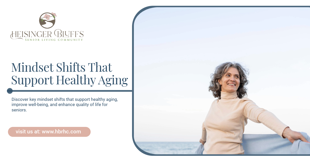 Woman with gray hair smiling, holding scarf on beach.