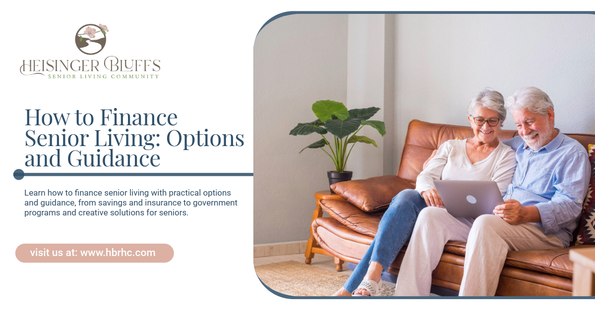 An elderly couple looks at a laptop on a couch. 