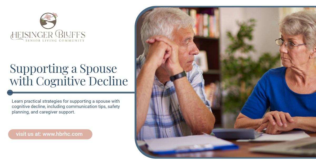 An elderly couple sitting beside each other looking at documents