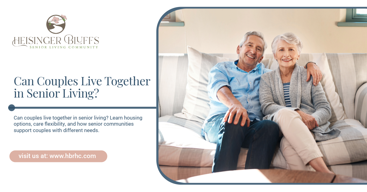 A couple living in senior living sitting together on a couch