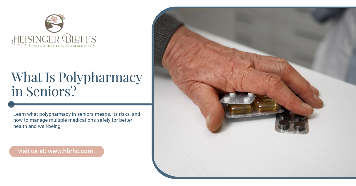 A senior's hand rests on two blister packs of medication