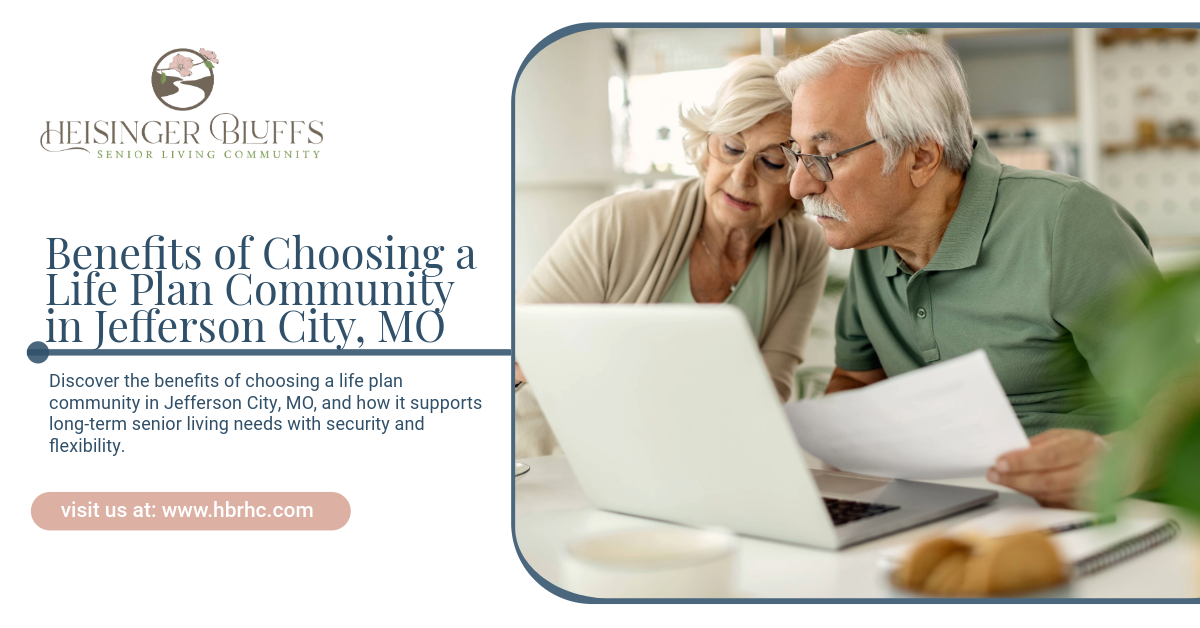 An elderly man and woman are looking for life plans on a laptop computer.