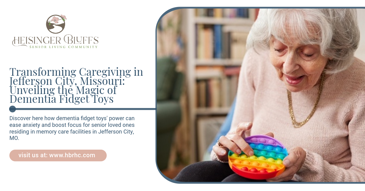 An elderly woman holding a rainbow-colored fidget toy