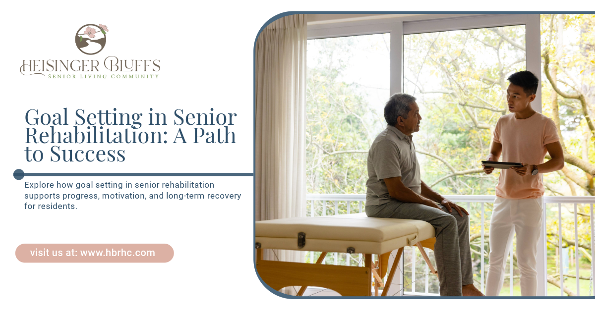 An elderly amn is sitting on a table talking to a senior rehabilitation assistant