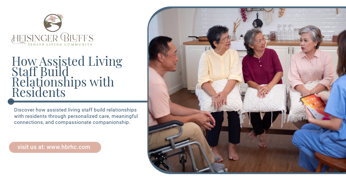 A group of senior living residents are sitting on a couch talking to a nursing staff.