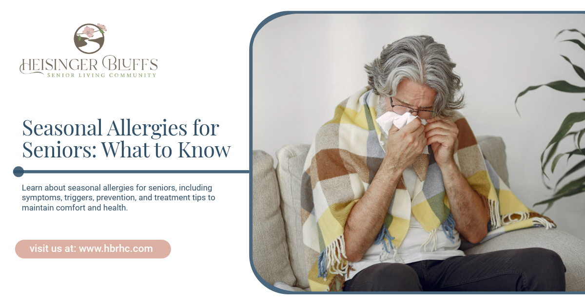 An elderly man is blowing his nose, wrapped in a blanket.