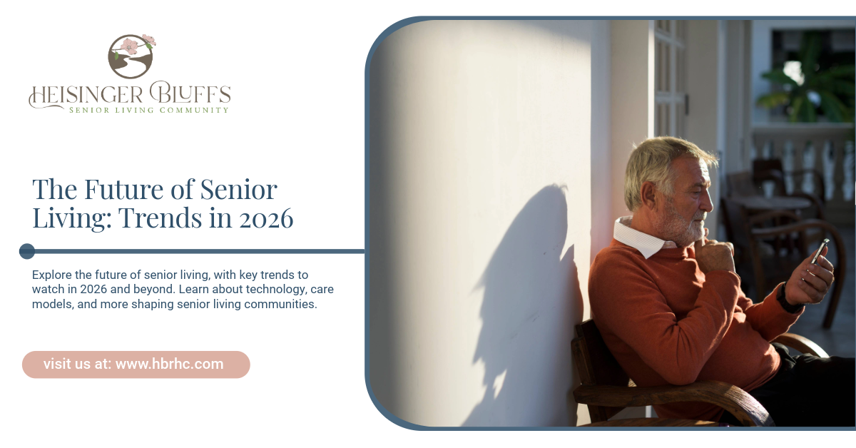 An elderly person sitting outdoors using a mobile phone