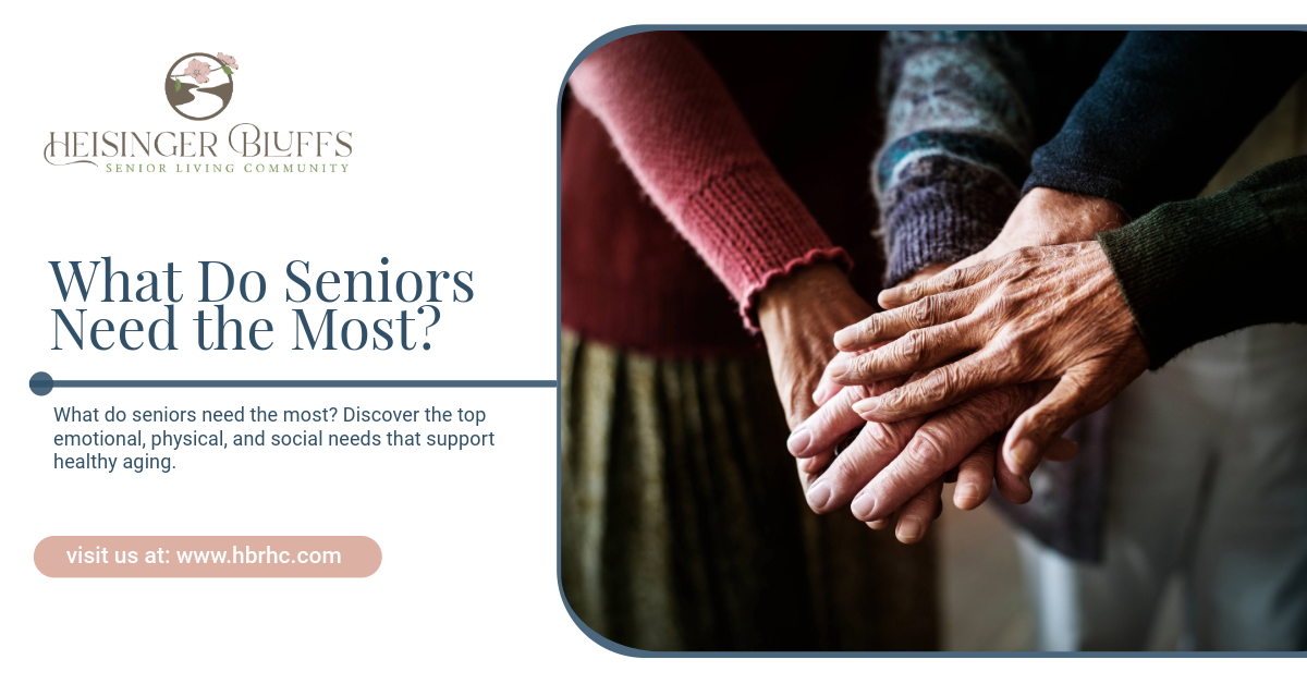A group of older people are stacking their hands together.