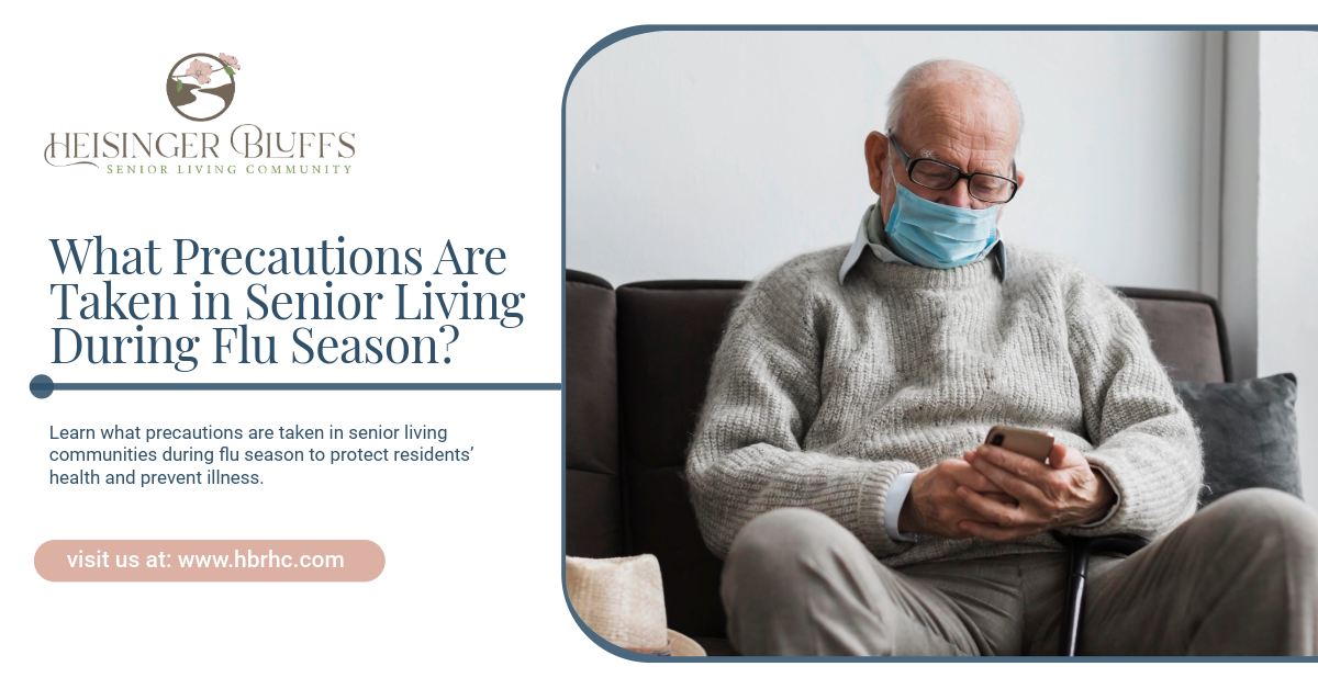 A senior living resident sitting on a couch, wearing a mask