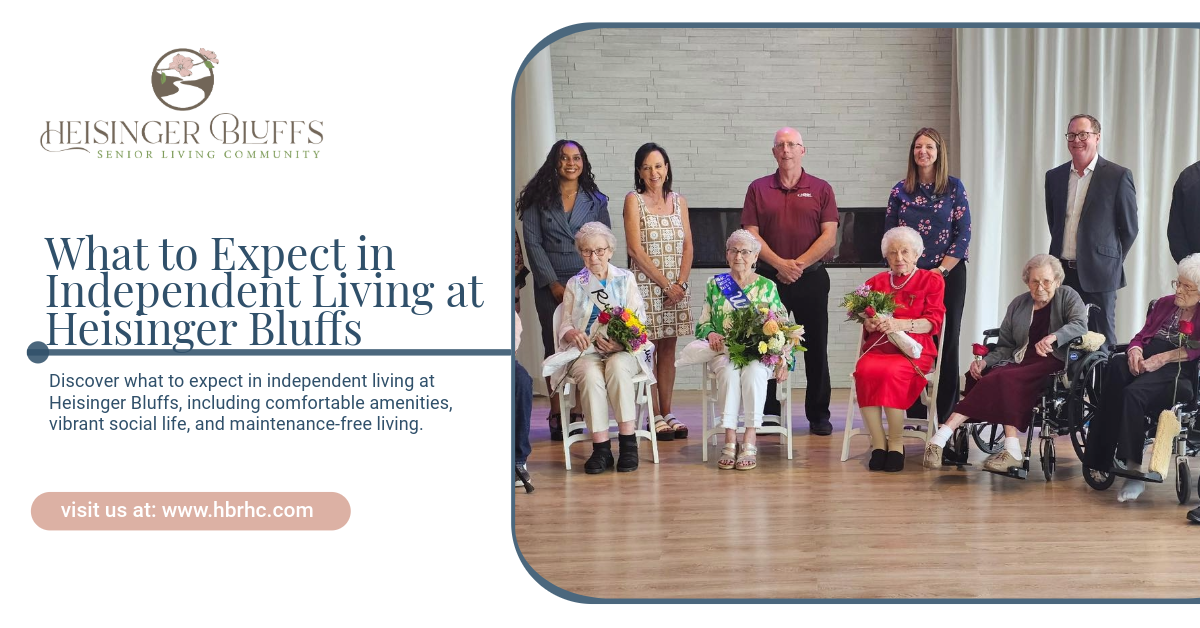 Residents at Heisinger Bluffs are standing next to each other in a room posing for a photo op