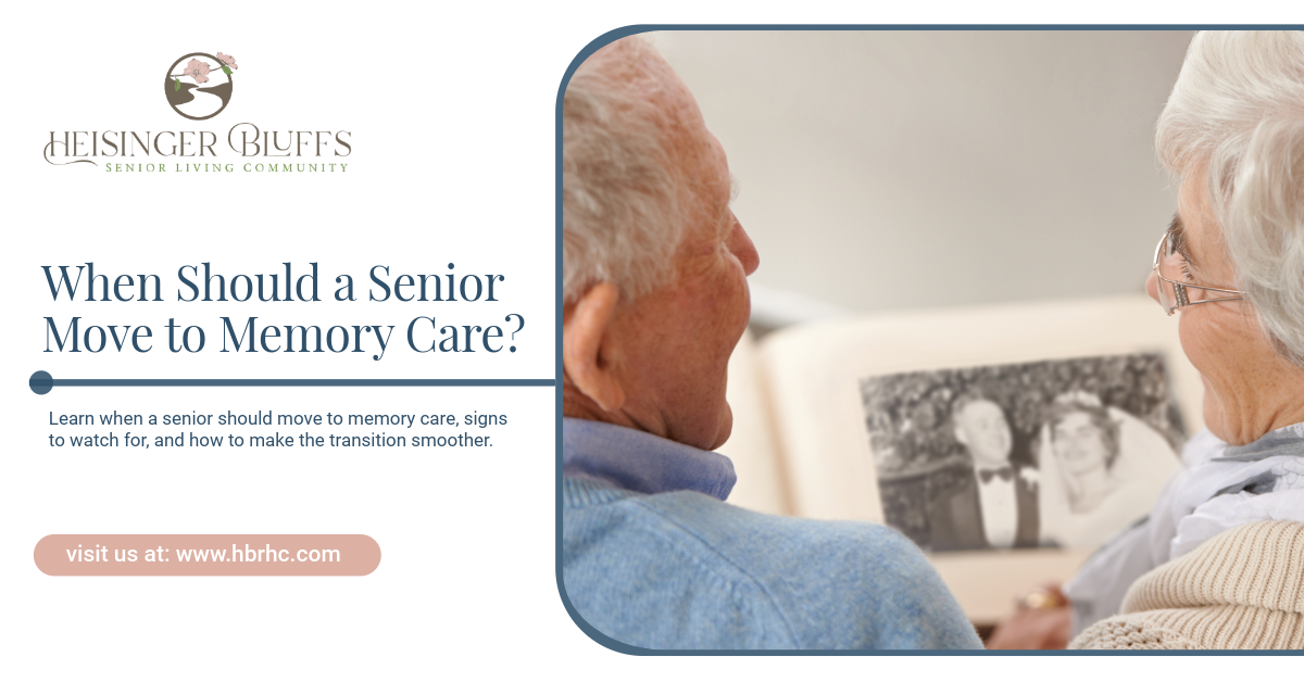 Two elderly couple looking at a photo album