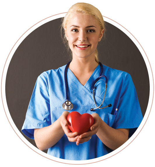 A nurse holding a red heart in her hands