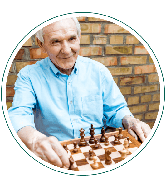 A man in a blue shirt  playing chess