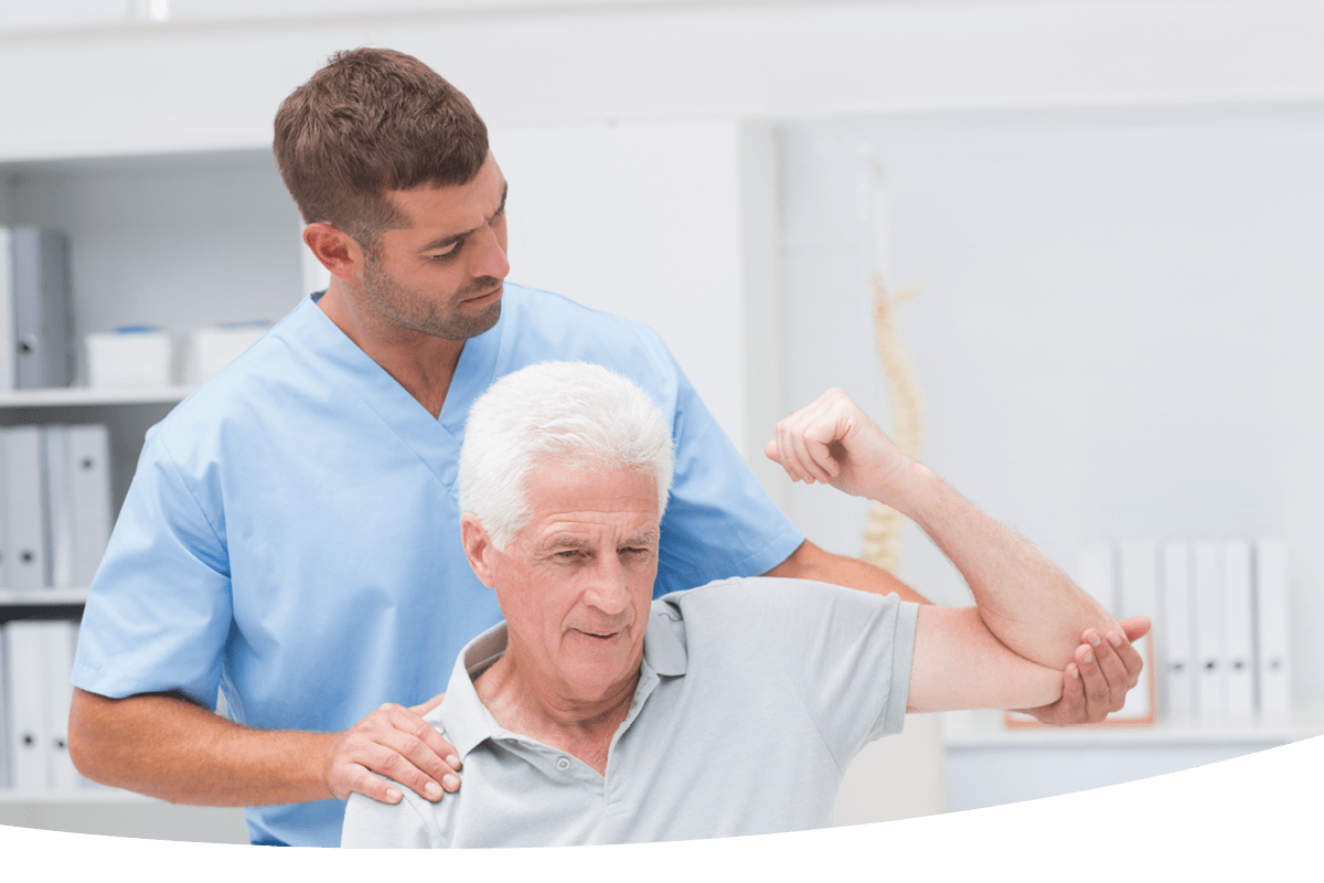 An elderly man being helped by a nurse to stretch his arm