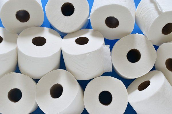 Many rolls of toilet paper are stacked on top of each other