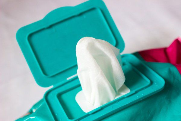A close up of a box of wet wipes with the lid open.