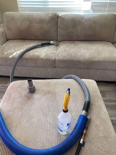 Before and after shots of a tan carpet. The left side is stained; the right side is clean.