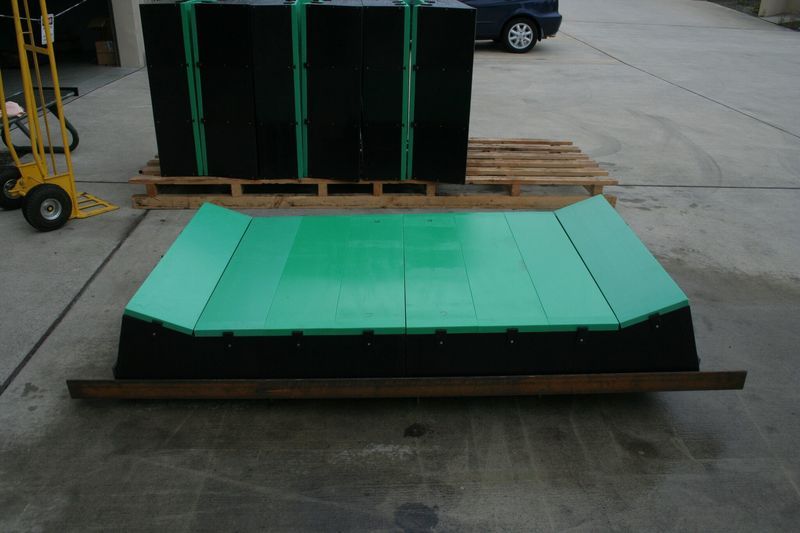 A green and black item is sitting on a wooden pallet - Engineering Tooling In Thornton, NSW