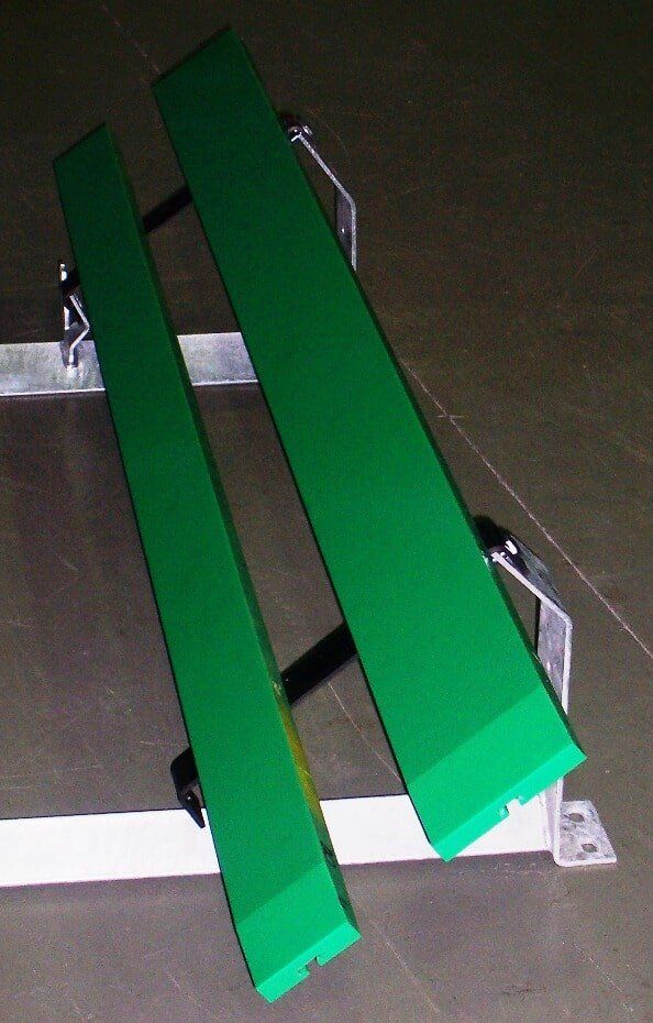 A green bench is sitting on a concrete floor - Engineering Tooling In Thornton, NSW