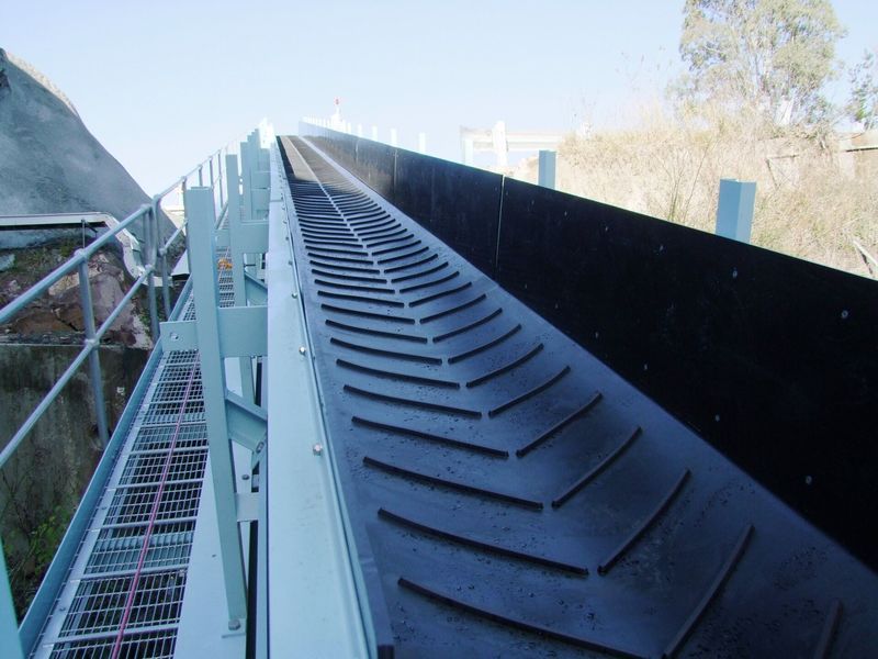 A conveyor belt with a chevron pattern on it - Engineering Tooling In Thornton, NSW