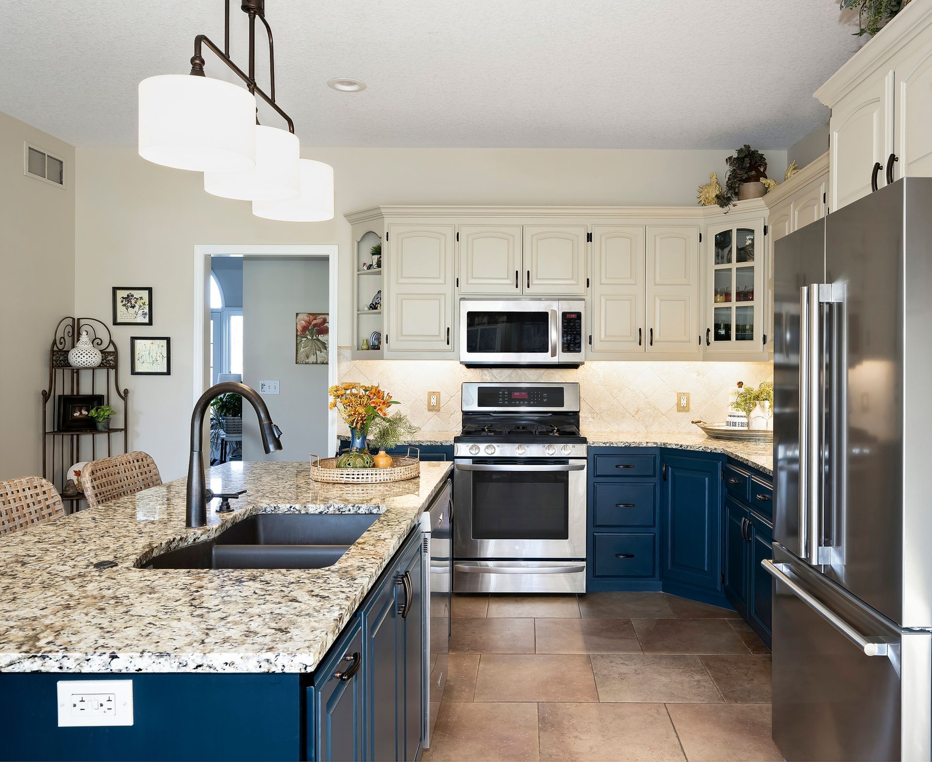 A kitchen with stainless steel appliances and granite counter tops