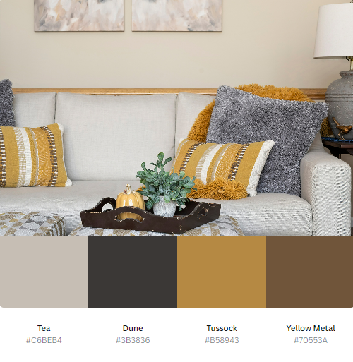 A living room with a couch and pillows and a palette of colors