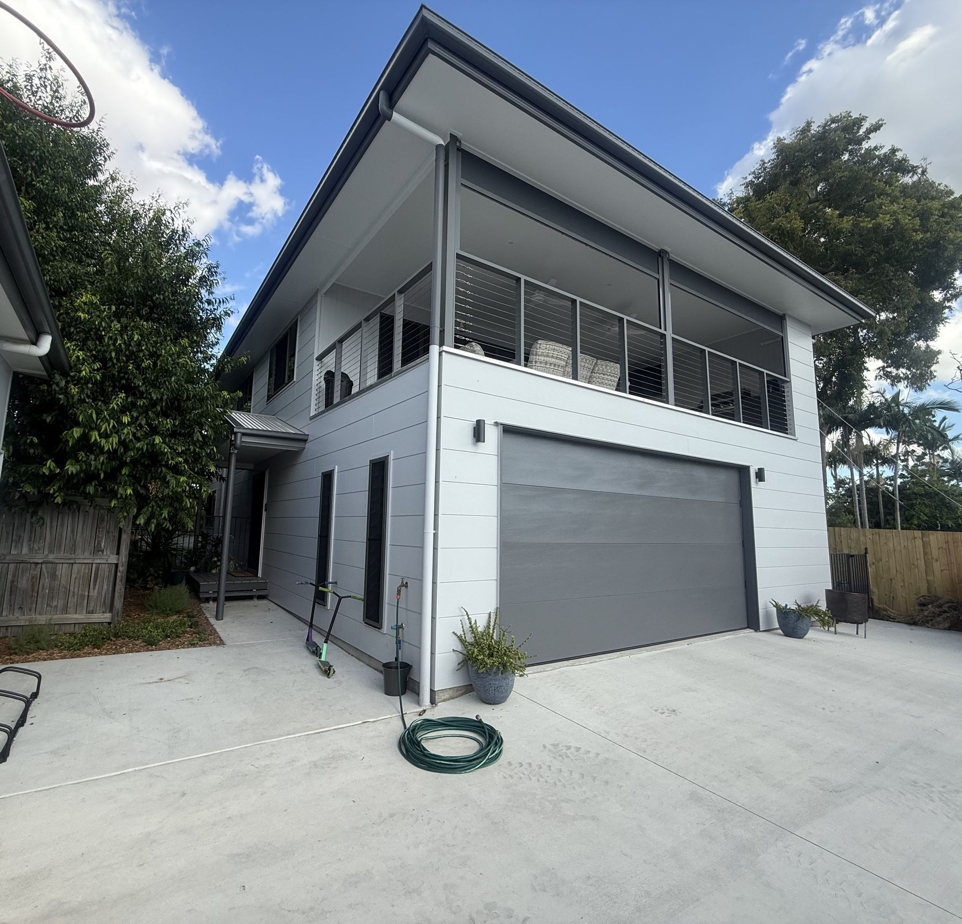 A Set of Stairs Leading Up to the Second Floor of a House — Werry Building Services in Boyne Island, QLD