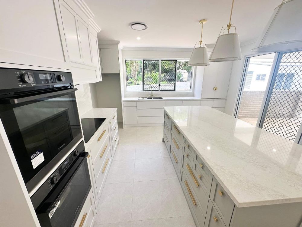 A Bathroom With a Tub, Sink, Mirror and Walk in Shower — Werry Building Services in Boyne Island, QLD