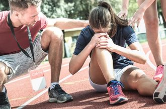 Female Athlete Getting Injured — Moulton, AL — Plaxco Chiropractic Clinic