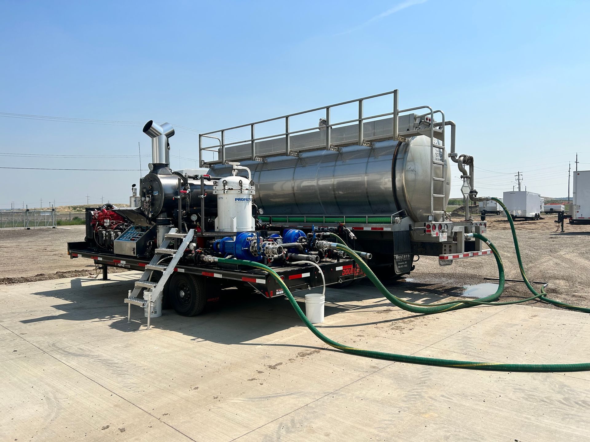 A large tanker truck is being filled with water