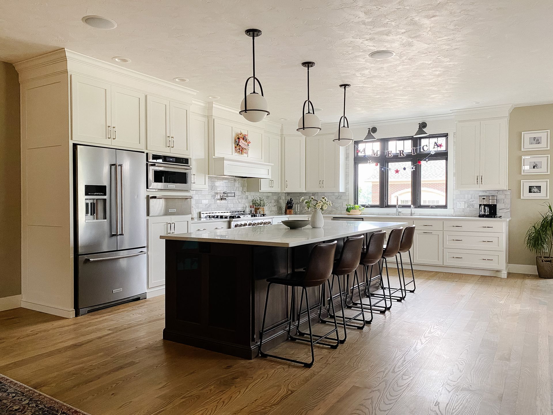Island table with hanging lights.