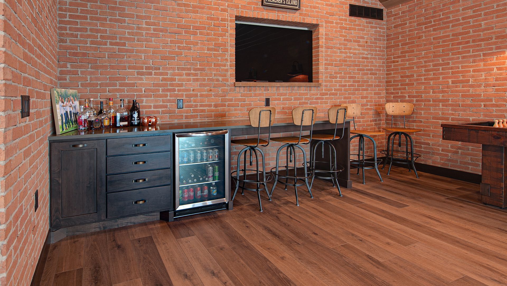 A minibar with fridge for drink to mix and extra chairs for guests.