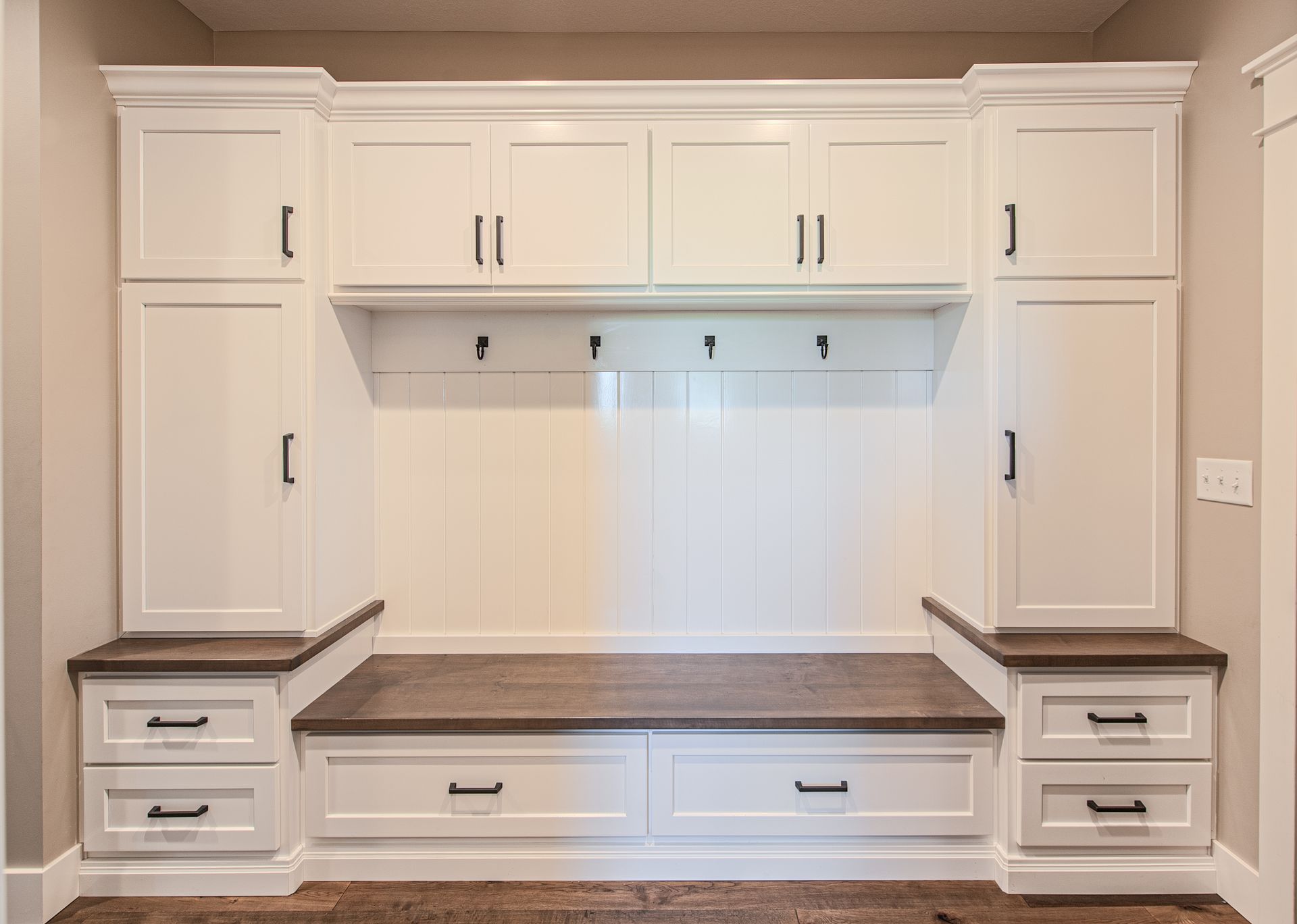 A full wardrobe room with 4 racks to hang backpacks or coats.